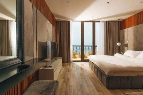 Postel nebo postele na pokoji v ubytování Mercury Beach DaNang