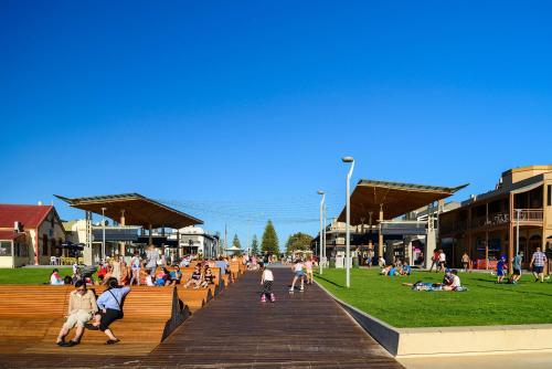 a group of people on a boardwalk in a park at Relaxing 3BR Beachside Haven Grange in Grange