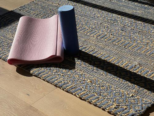 two notebooks sitting on top of a rug at Queensview168 Apartments Moonee Ponds in Melbourne
