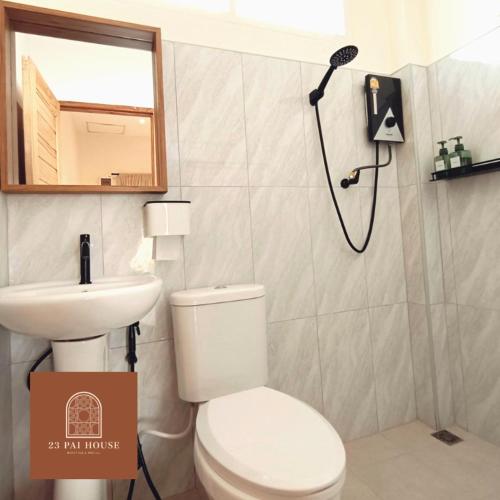 a bathroom with a shower and a toilet and a sink at 23 PAI HOUSE boutique hotel in Pai