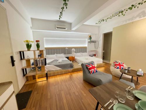 a living room with a bed and a couch at Central of Sunway Town; 8 PAX in Petaling Jaya