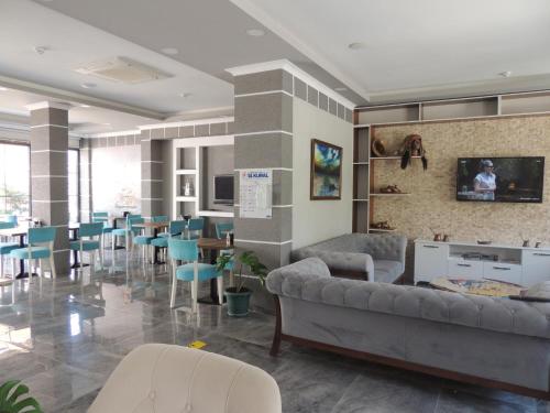 a waiting room with couches and chairs and tables at Sogutpark Hotel in Trabzon
