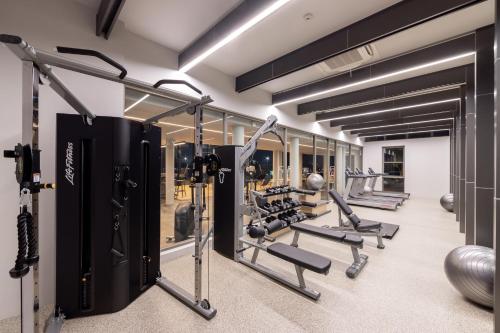 a gym with treadmills and machines in a room at Travelodge Nimman in Chiang Mai