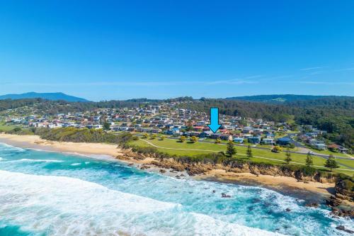 an aerial view of a beach with a resort at 1 15 Dalmeny Drive Kianga in Kianga