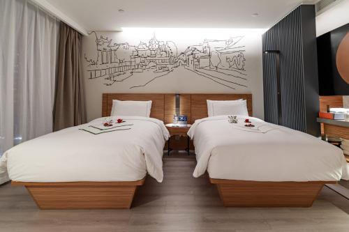 UrCove by HYATT Nanjing South Railway Stationにあるベッド