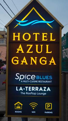 a sign for a hotelzaza gamma with yellow and blue at Hotel Azul Ganga in Rishīkesh