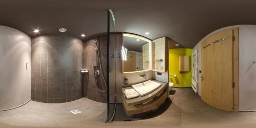 Koupelna v ubytování Familotel Alphotel