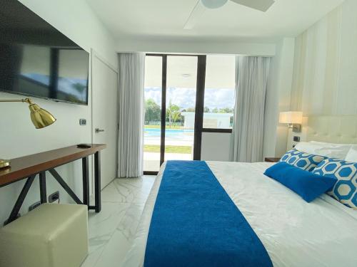 Postel nebo postele na pokoji v ubytování Condo directo a la piscina en Hard Rock Punta Cana area