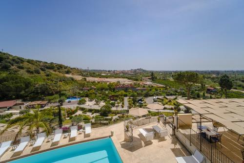 an aerial view of a resort with a swimming pool at Don Vittorio Country Village in Taormina