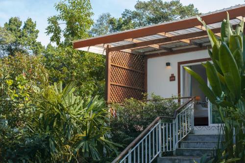 a house with a staircase leading to the front door at La Passion by Achariyak in Koh Rong Sanloem