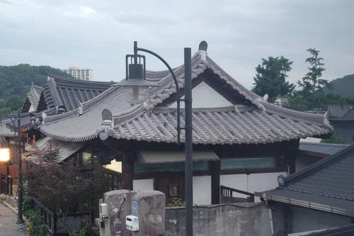 a building with a street light in front of it at Hyanggyo-gil, Seonwooga in Jeonju