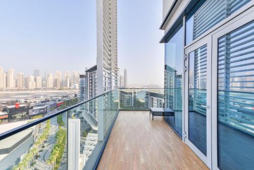an apartment balcony with a view of the city at Spectacular 3 BR condo with maids room facing the Dubai Eye in Dubai