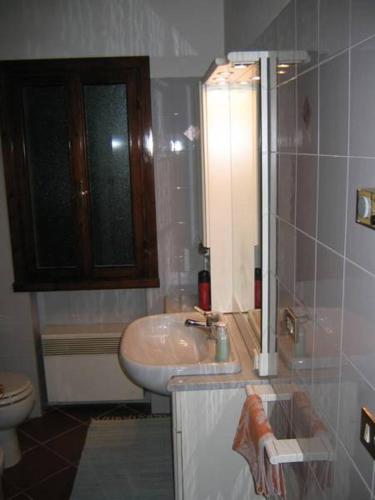 a bathroom with a sink and a toilet at Casarosa B&B in Piazzola sul Brenta