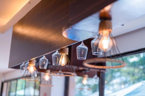 a bunch of lights hanging from a kitchen ceiling at Island Wanderers Inn in Coron
