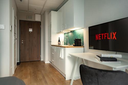 Televízia a/alebo spoločenská miestnosť v ubytovaní Perfect View Apart's
