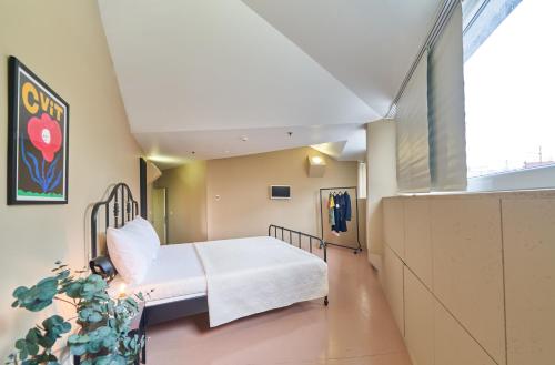 Un ou plusieurs lits dans un hébergement de l'établissement Design Hostel One