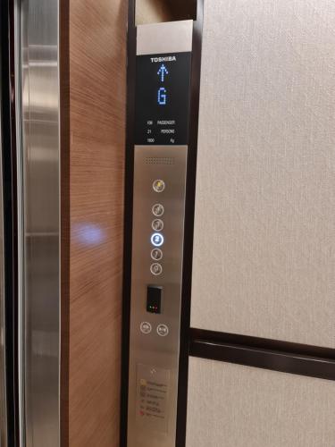 a control panel for an elevator in a room at Two Bedroom-The Address Beach Resort Fujairah in Sharm