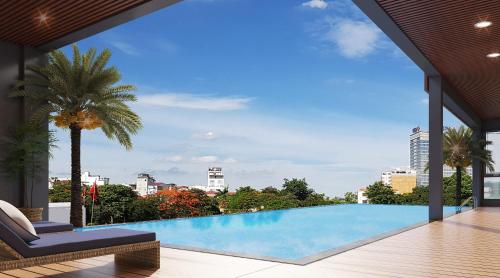 a swimming pool with a view of a city at D'Lecia Ha Long Hotel in Ha Long