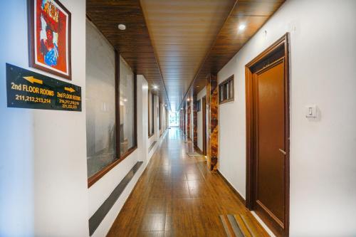 a hallway of a building with a hallway at Pax Hotel Ark 150 meters from Mall Road in Dalhousie