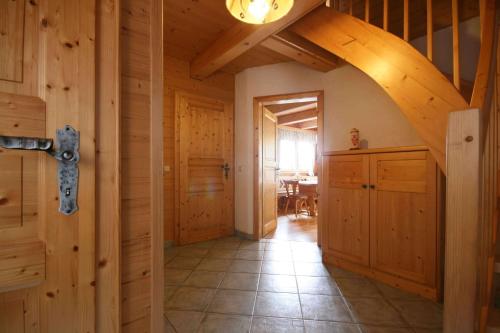a hallway in a log cabin with a wooden ceiling at Almliesl KATH-631 