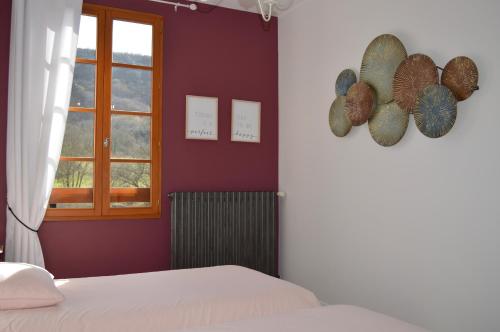 Ένα ή περισσότερα κρεβάτια σε δωμάτιο στο Maison Maliga J&G House