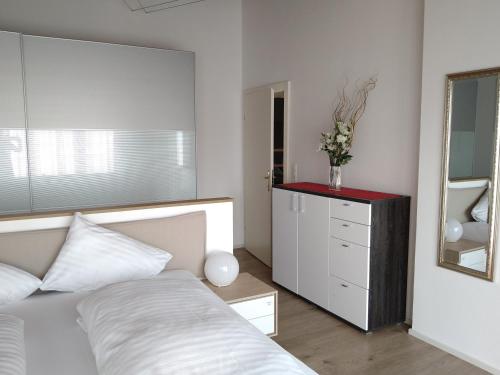 Postel nebo postele na pokoji v ubytování Appartements am Kirchplatz