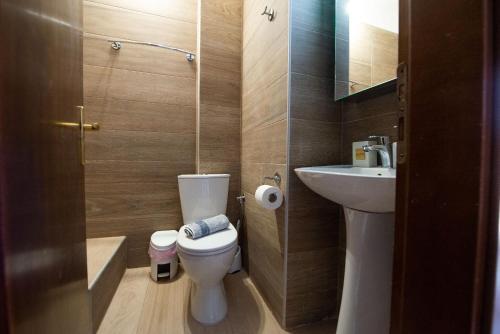 a small bathroom with a toilet and a sink at Stella's Beach House in Nikiti