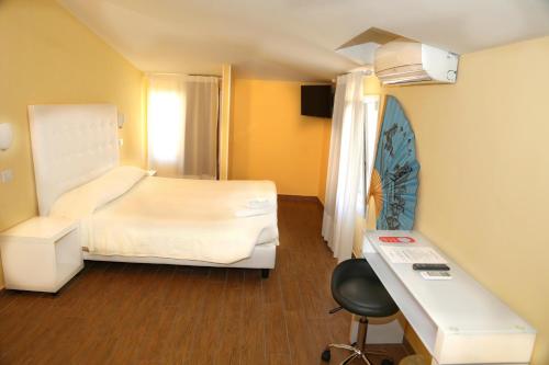Кровать или кровати в номере Via Mameli 5