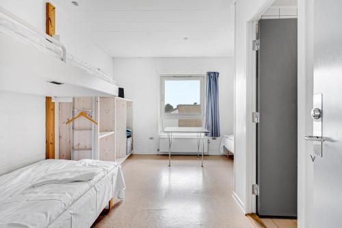 Postel nebo postele na pokoji v ubytování Danhostel Nørresundby Skansen