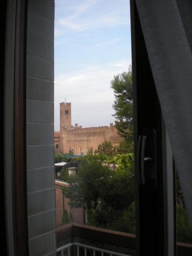 a view of a castle from a window at B&B Casa Mancini in Rimini