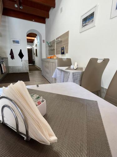 a hospital room with a bed and a table at Affittacamere Vicino al Porto in Porto Torres