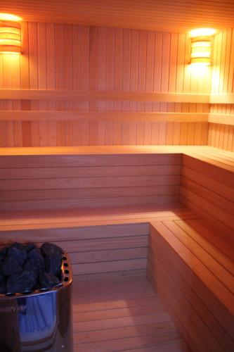 a sauna with a trash can and lights in it at Ankawa Royal Hotel & Spa in Erbil