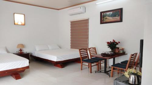 Postel nebo postele na pokoji v ubytování Nha Xanh Homestay