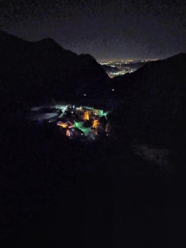 a night view of a house on a hill at Loggia in Vobarno