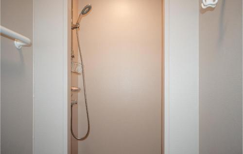 a shower with a shower head in a bathroom at Beautiful Home In Reftele With Wifi in Reftele