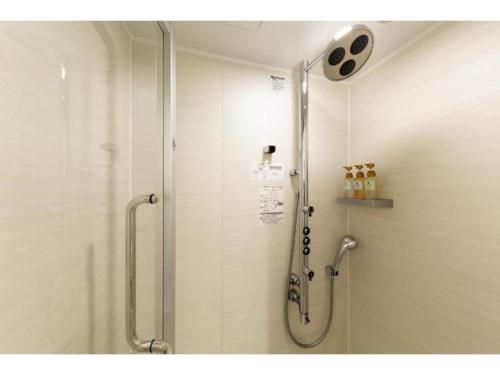 a shower with a glass door in a bathroom at The OneFive Kyoto Shijo - Vacation STAY 41807v in Kyoto