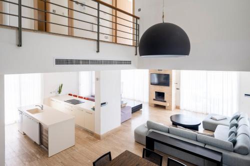 a living room with a couch and a table at AAA SEAVIEW PANORAMA in Pervolia