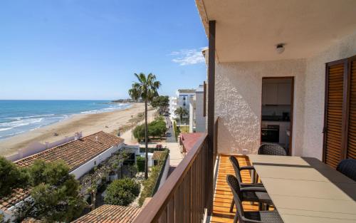 a balcony with a view of the beach at Apartamento con vistas frontales - Primera línea Playa Cargador - ALBERT VILLAS in Alcossebre
