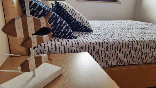 Postel nebo postele na pokoji v ubytování Home & Sea Villasimius