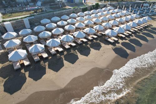 an overhead view of a row of umbrellas on the beach at Kalia Beach Hotel Side in Side