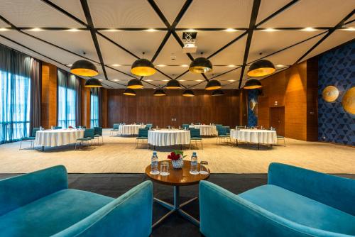 a banquet hall with tables and chairs in a room at Barceló Anfa Casablanca in Casablanca
