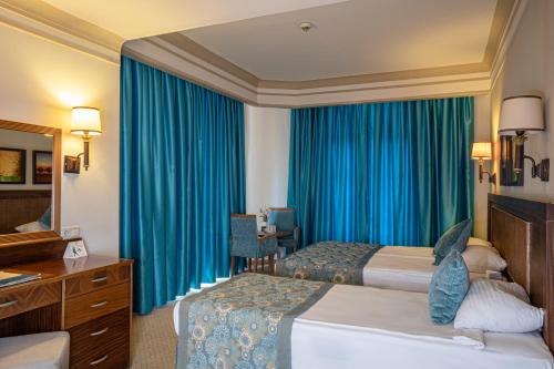 Letto o letti in una camera di Villa Side Hotel