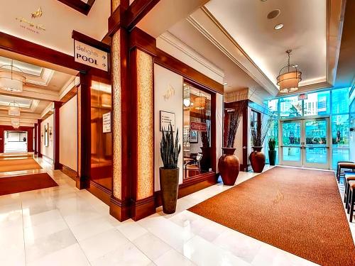 a lobby of a building with a potted plant at Amalz 2 Bedroom 3 Bathroom Balcony Suites at Mgm Signature ! in Las Vegas