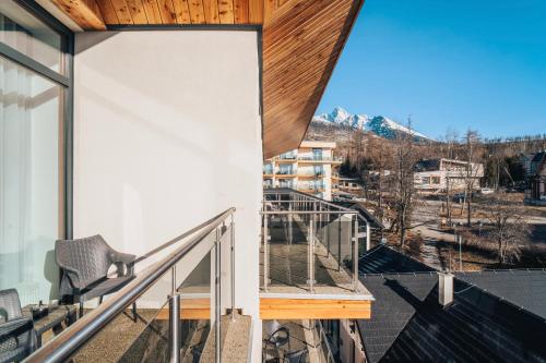 a view from the balcony of a house at Apartmány Tatry in Smokovce