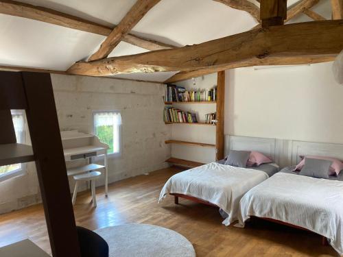 Postel nebo postele na pokoji v ubytování Les Ganivelles