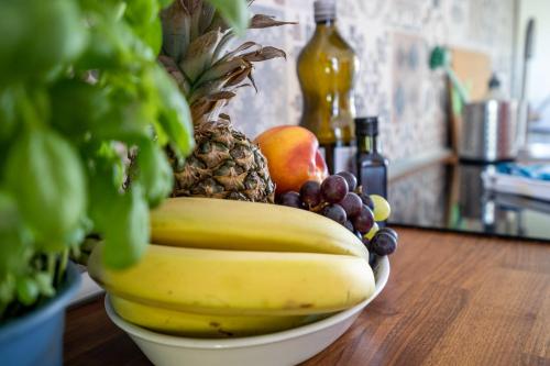 a bowl of fruit sitting on a table at FeWo Haus kleine Müritz in Rechlin