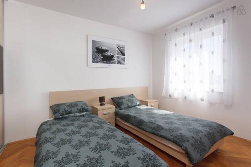 Katil atau katil-katil dalam bilik di Apartment Lana