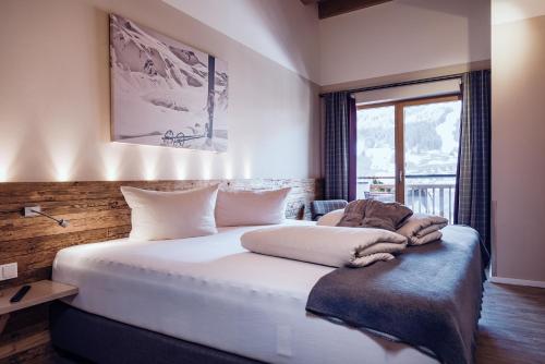 Postel nebo postele na pokoji v ubytování Familienresort Ellmauhof - das echte All Inclusive