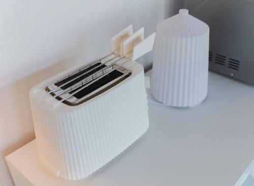 a white container sitting on top of a desk with a keyboard at Casa Celeste in Clusone