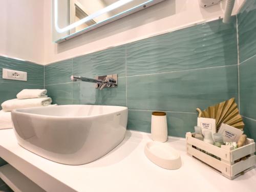 a bathroom with a large white sink on a counter at B&B A Due Passi in Ischia